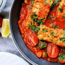 Fish with herbs in tomato sauce
